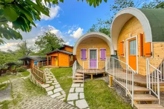 View of the iconic chalets of the Parco dei Castagni campsite in Emilia-Romagna