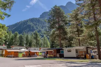 view of the pitches immersed in the Belluno woods of the Alleghe Resort campsite