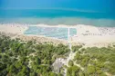 panoramic view of the pine forest and the beach of Cieloverde camping in Marina di Grosseto in Tuscany