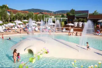 view of the swimming pool area with maxi screen of the HU Firenze Camping in Town in Tuscany