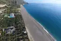 overview of the beach, sea, pitches, swimming pool of the paradise campsite in taormina