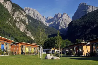 View of the Dolomites from the camping beach of Molveno Lake in Trentino