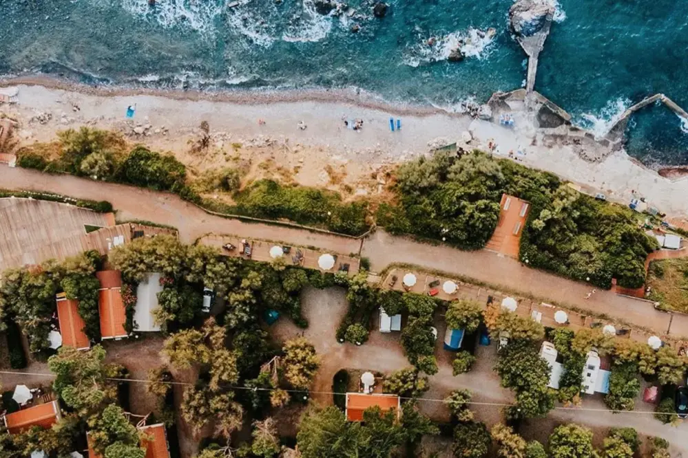 Camping Village Miramare seen from above with its private beach in Tuscany