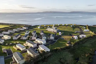 Pitches and mobile homes overlooking the ocean on Galway Bay in Ireland